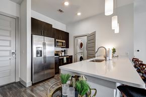 San Antonio apartment for rent - a kitchen with stainless steel appliances and a large white counter top