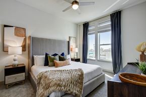 San Antonio apartment for rent - a bedroom with a large bed and a large window