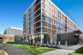 Washington apartment for rent - a large building with a sidewalk in front of it