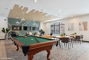 Eden Prairie apartment for rent - A room with a pool table and a dining table.