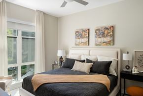 Alexandria apartment for rent - a bedroom with a bed and two paintings on the wall
