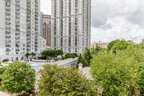 Atlanta apartment for rent - an aerial view of a city with tall buildings and trees
