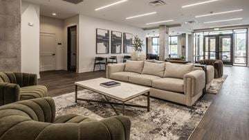 Westfield apartment for rent - A modern living room with a large sectional sofa and a coffee table.