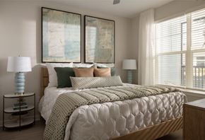 Johns Island apartment for rent - A bedroom with a large bed and two lamps.
