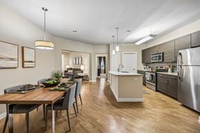 San Antonio apartment for rent - A modern kitchen with a dining table and chairs.