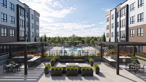 Parsippany apartment for rent - A large outdoor patio area with a pool and seating arrangements.