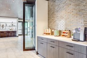 Cambridge apartment for rent - A kitchen with a counter and a wall of tiles.