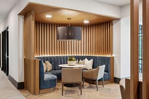 Ft Worth apartment for rent - A modern dining area with a wooden table and chairs.