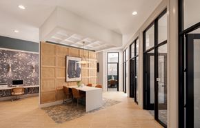 Johns Island apartment for rent - A modern office space with a wooden reception desk and chairs.