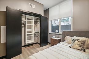 Washington apartment for rent - a bedroom with a bed and a closet