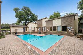 Dallas apartment for rent - A small pool surrounded by a brick patio.