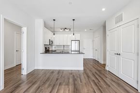 Norwalk apartment for rent - A kitchen with white cabinets and a wooden floor.