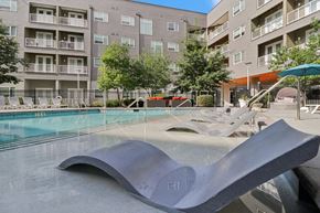 Kansas City apartment for rent - A large metal sculpture sits in the middle of a pool.