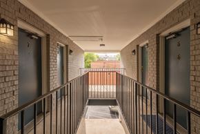 Nashville apartment for rent - A long hallway with doors 6 and 7 on the side.