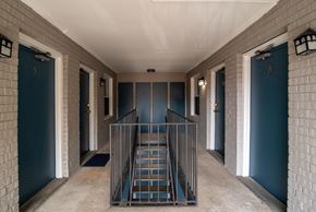 Nashville apartment for rent - A staircase with a metal railing leads to a door with the number 8 on it.