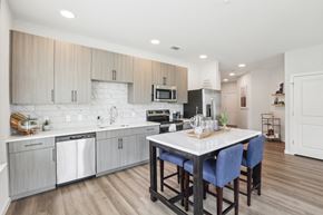 Holly Springs apartment for rent - A modern kitchen with a dining table and chairs.