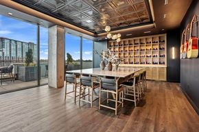 Nashville apartment for rent - A dining room with a long table and chairs.