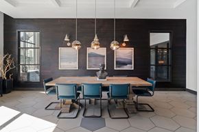 Nashville apartment for rent - A dining room with a wooden table and blue chairs.