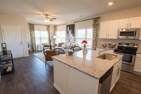 Athens apartment for rent - Spacious kitchen with an island, ample storage, stainless steel appliances and view into the living room.