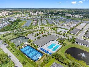 Delray Beach apartment for rent - an aerial view of a city with buildings and a pool