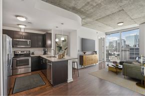 Atlanta apartment for rent - A modern kitchen with dark wood cabinets and stainless steel appliances.