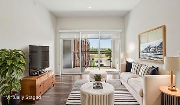 Frisco apartment for rent - A living room with a white couch and a television.