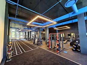 Plantation apartment for rent - A gym with a variety of equipment including weights and weight racks.