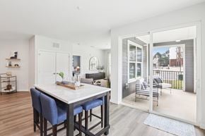 Holly Springs apartment for rent - A dining area with a table and chairs is shown.
