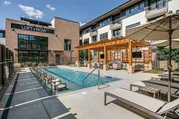 Dallas townhouse for rent - A pool area with a sign that says "LOFT + ROW".