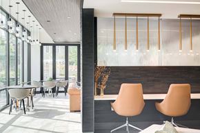 Cambridge apartment for rent - A modern dining area with a long table and chairs.