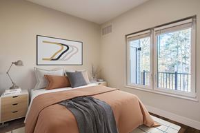 Norwalk apartment for rent - The Beacon furnished bedroom with window next to the balcony with a storage closet