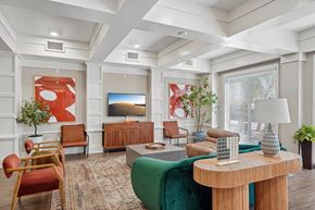 Peoria apartment for rent - A living room with a green sofa and a wooden coffee table.