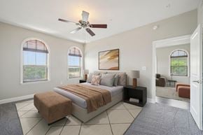 San Antonio apartment for rent - A bedroom with a large bed and a ceiling fan.