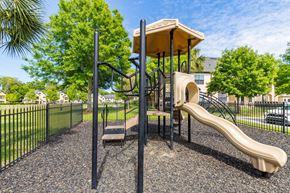 Gainesville apartment for rent - A playground with a slide and a climbing frame.
