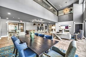 Austin apartment for rent - a clubhouse with a dining room table and chairs