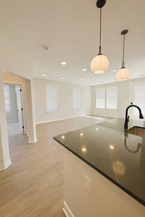 Zionsville apartment for rent - A kitchen with a black counter top and a sink.