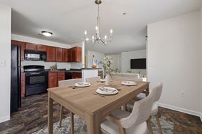 Carlisle apartment for rent - A dining room with a wooden table set for two.