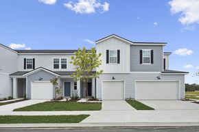 Jacksonville apartment for rent - A two-story house with a garage on the side.