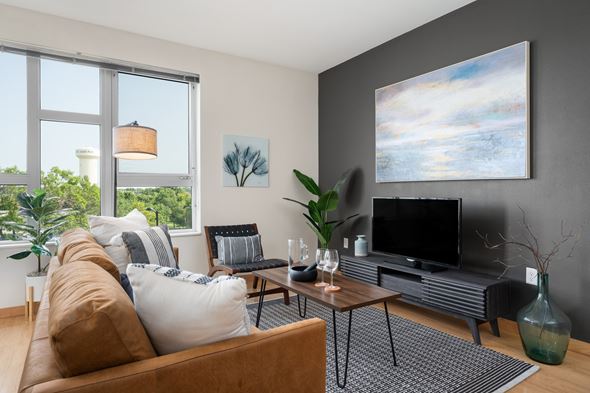 St. Louis Park apartment for rent - a living room with a couch and a television at Verge Apartments in St. Louis Park, MN
