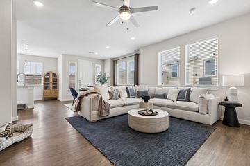Fort Worth apartment for rent - A modern living room with a white sofa set and a round coffee table.