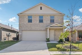 Mckinney apartment for rent - A house with a garage and a driveway.