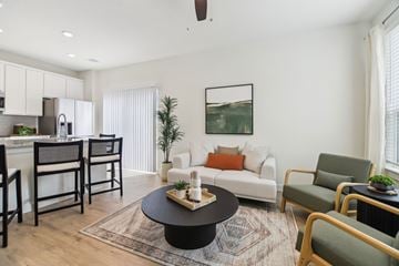 Midlothian apartment for rent - A living room with a black coffee table and a white couch.