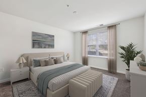 Carlisle apartment for rent - A bedroom with a large bed and a painting on the wall.