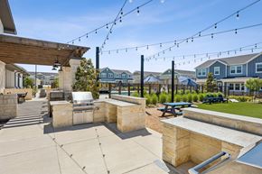 Sherman apartment for rent - A patio with a stone wall and a hot tub.