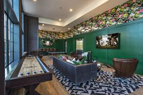 Salem apartment for rent - A room with a pool table and a green wall with a picture on it.