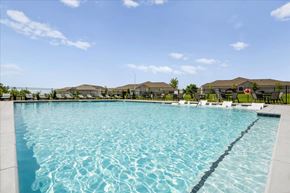 Kansas City apartment for rent - A large swimming pool with a blue tinted water.