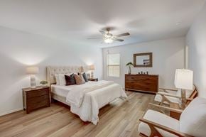 Mckinney apartment for rent - Large rustic bedroom, with light hardwood floors and naturally lit through windows on each wall