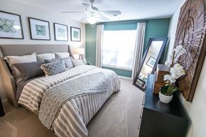 Salisbury apartment for rent - A bedroom with a large bed and a ceiling fan.