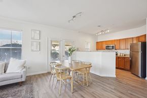 Knightdale apartment for rent - A modern kitchen with a dining table and chairs.