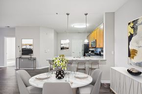 Cherry Hill apartment for rent - Cherry Hill, NJ, Garden-Style Apartments With In-Unit Washer and Dryer - The Highlands at Cherry Hill - Open-Concept Kitchen and Dining Area With Dining Table, Chairs, and Breakfast Bar Seating.
